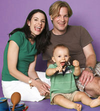 Mom and Dad have fun in music class with their baby