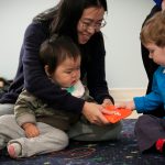 Babies in music class learning how to share.