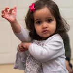 Child having fun dancing to music