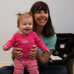 Mom and baby are happy singing together